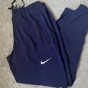 Nike Woven Mens Running Pants Medium Blue tapered zippered bottom.